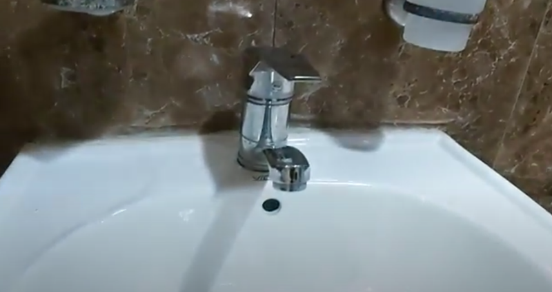 A faucet in a bathroom in an apartment