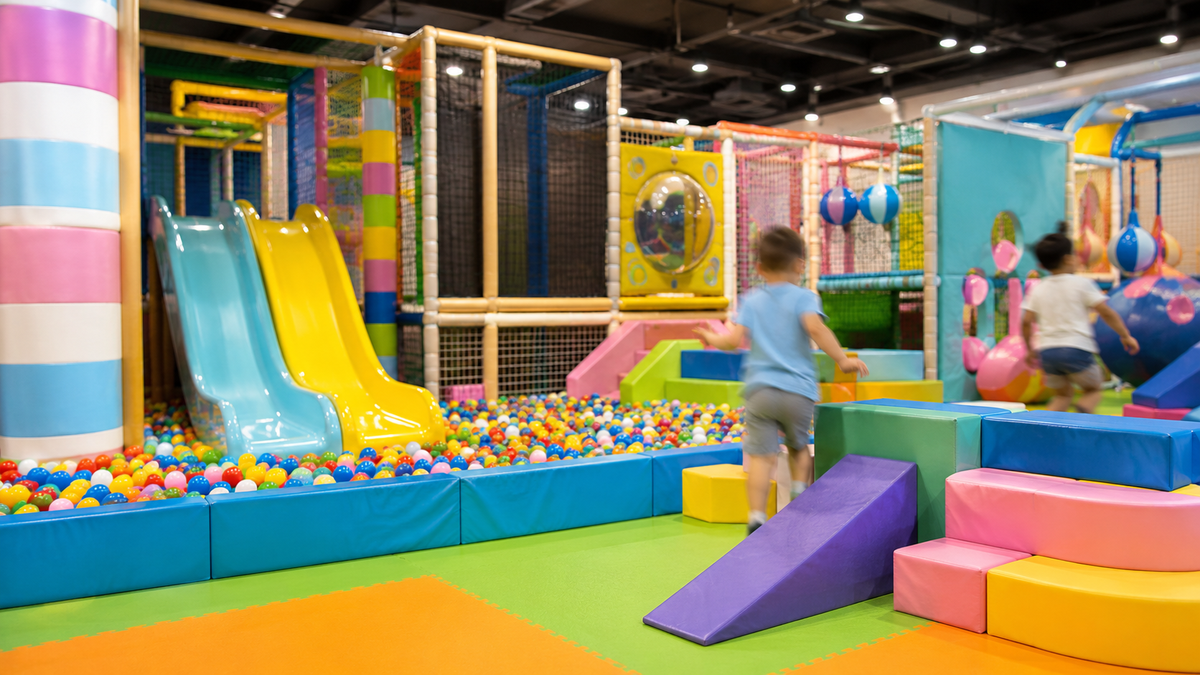 A colourful soft play area for children in an indoor entertainment centre.