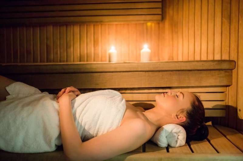Young woman in a sauna