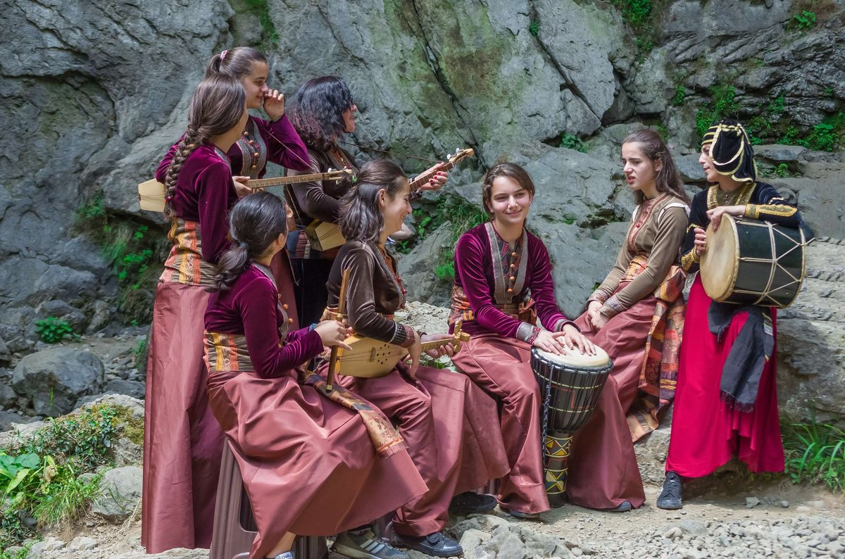 Georgian girls in national costumes with musical instruments