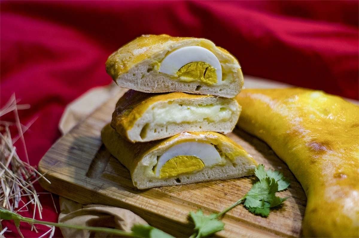 Gurian pies with egg on a red background