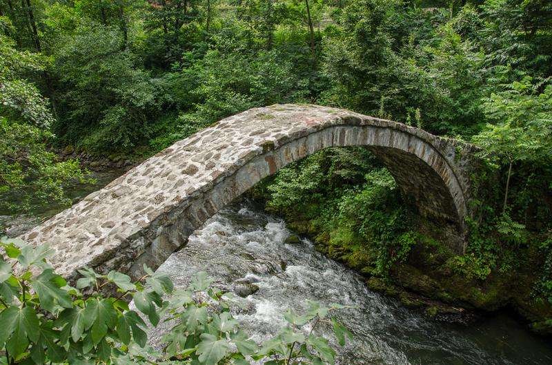 A stone bridge across a river in the Kintrish Nature Reserve