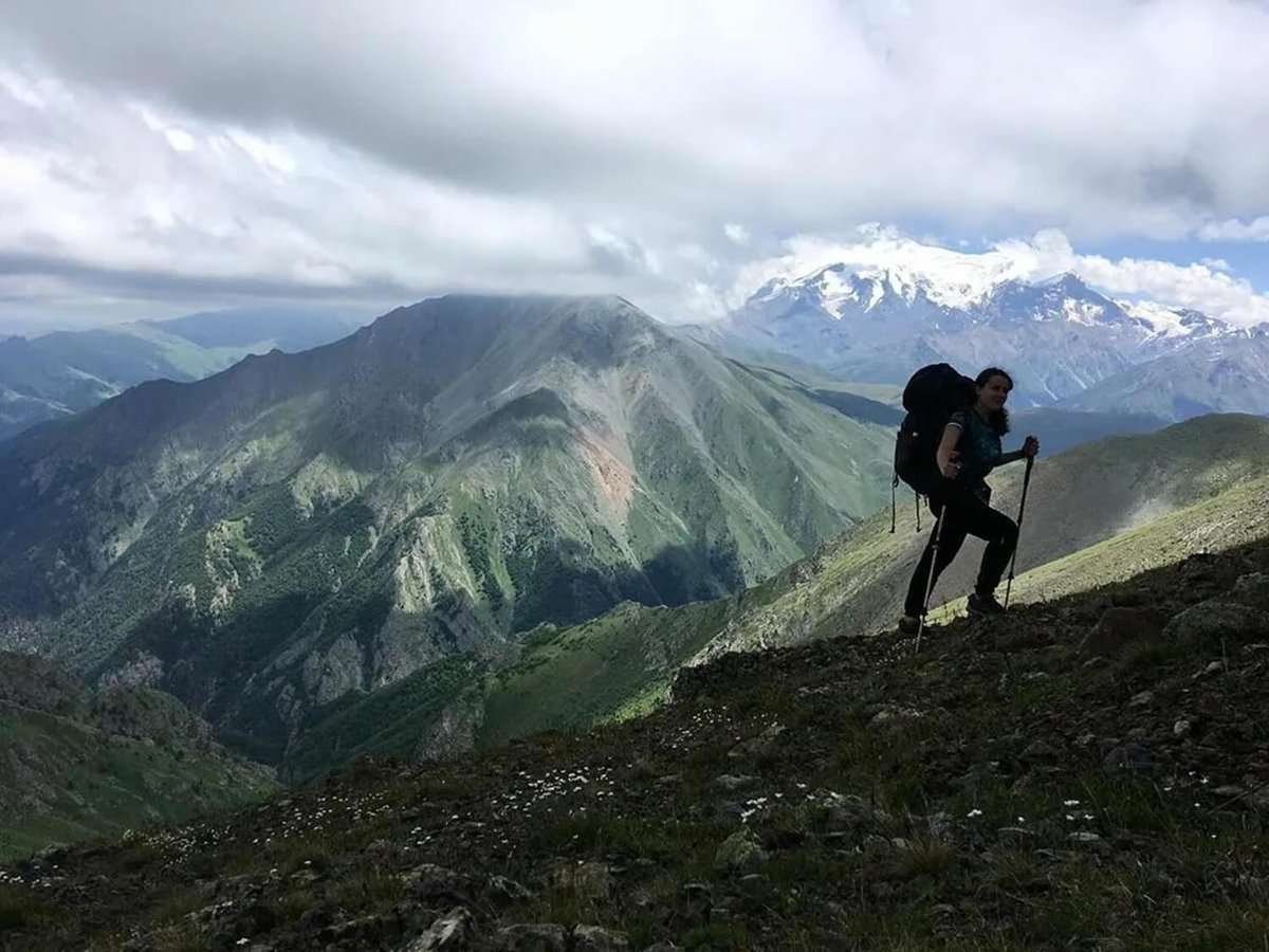 A girl climbs a mountain