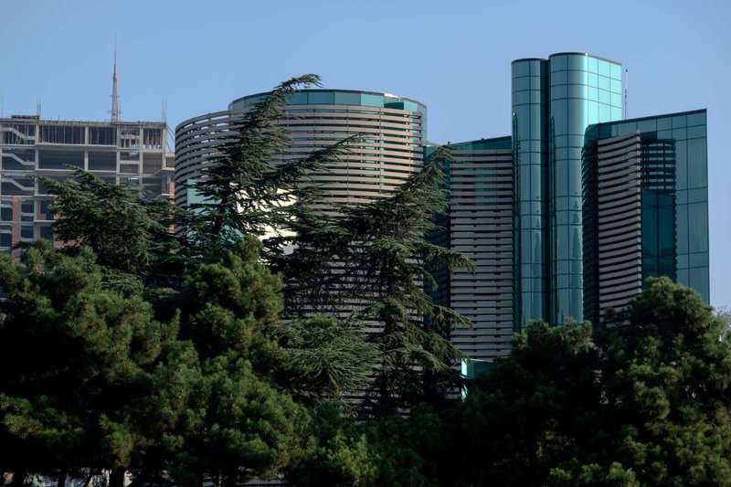 An office building surrounded by greenery