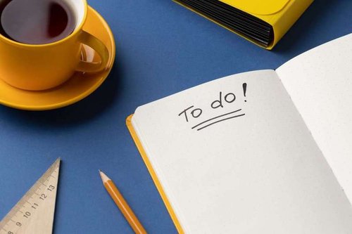 Flat notepad with a to-do list on the desk