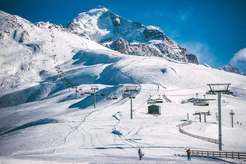 A skier descends from a mountain in Tetnuldi