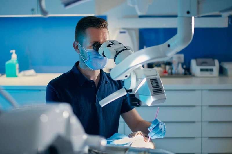 a dentist treats a patient