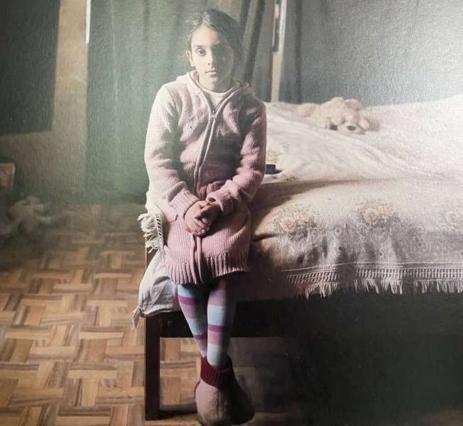 Ergeti War Museum - photo of a girl thrown out of a window by her mother to escape a fire