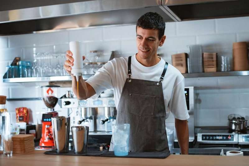 A barista prepares coffee