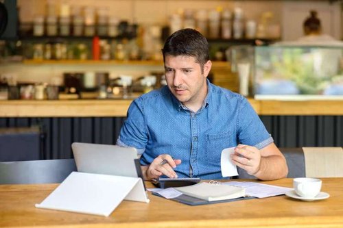 A businessman analyzes his competitors' receipts