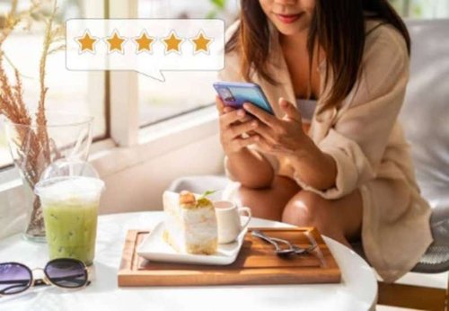 A satisfied girl leaves a positive review on Google Maps about her visit to a coffee shop.