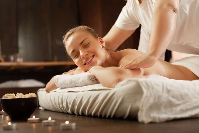 A girl receiving a massage from a professional massage therapist