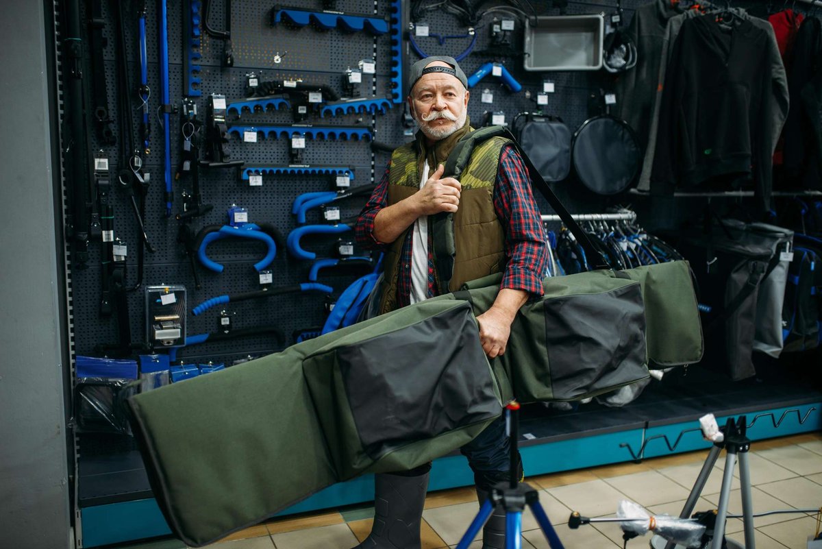 male-angler-holds-big-case-for-fishing