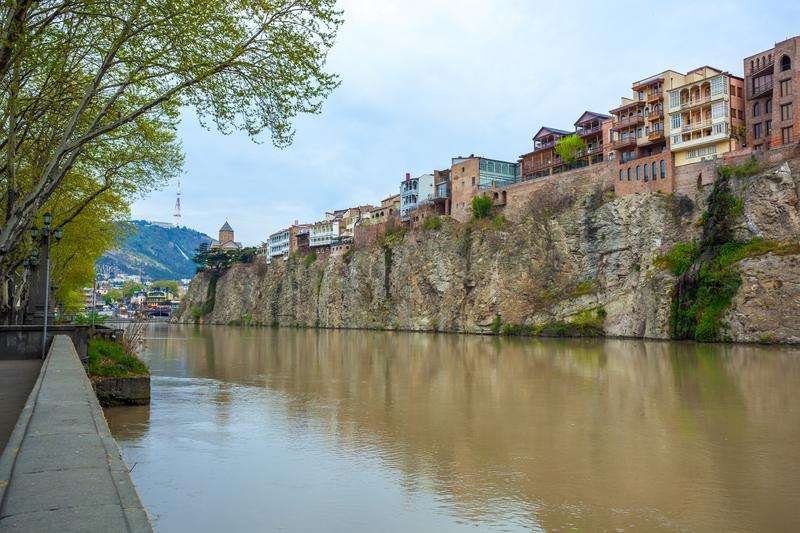 Metekhi Church and houses on the edge of a cliff above the Kura River