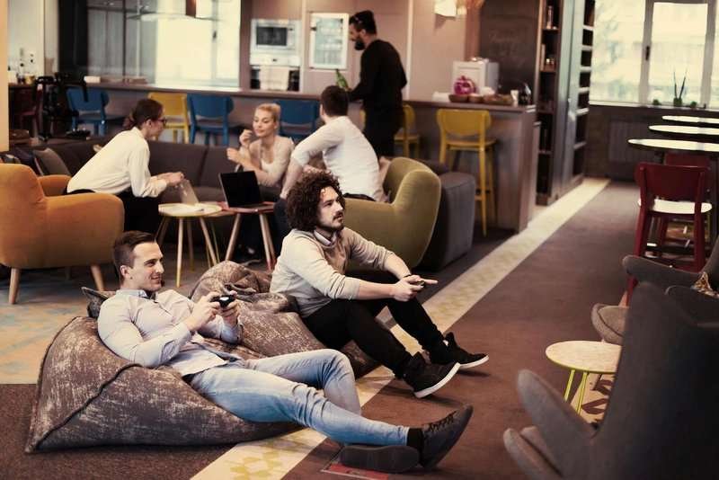 Young people playing games in a hostel