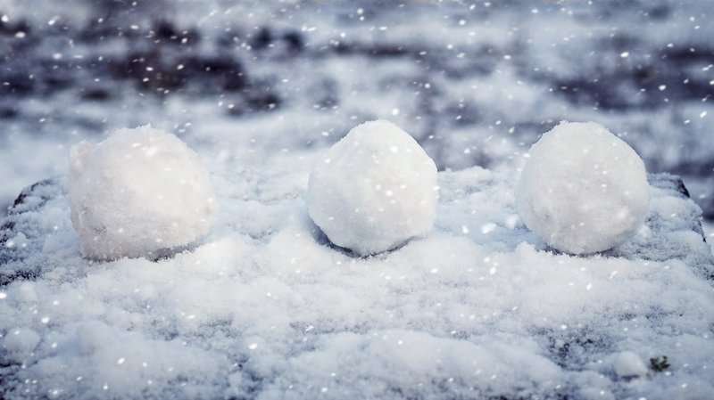 Snowballs on snowy ground