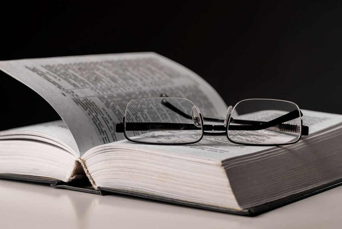 the glasses are on the book