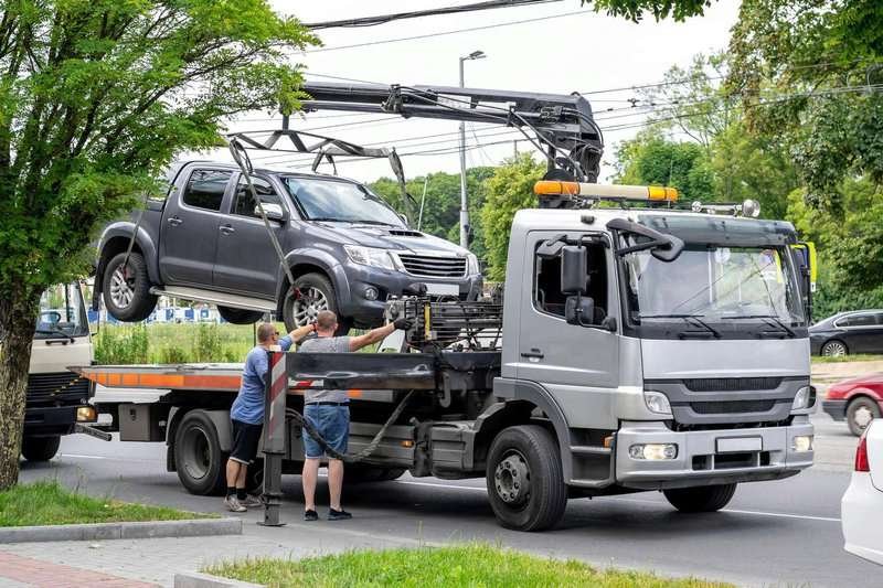 tow-truck-on-the-roadway-with-a-hooked-picku.max-800x600