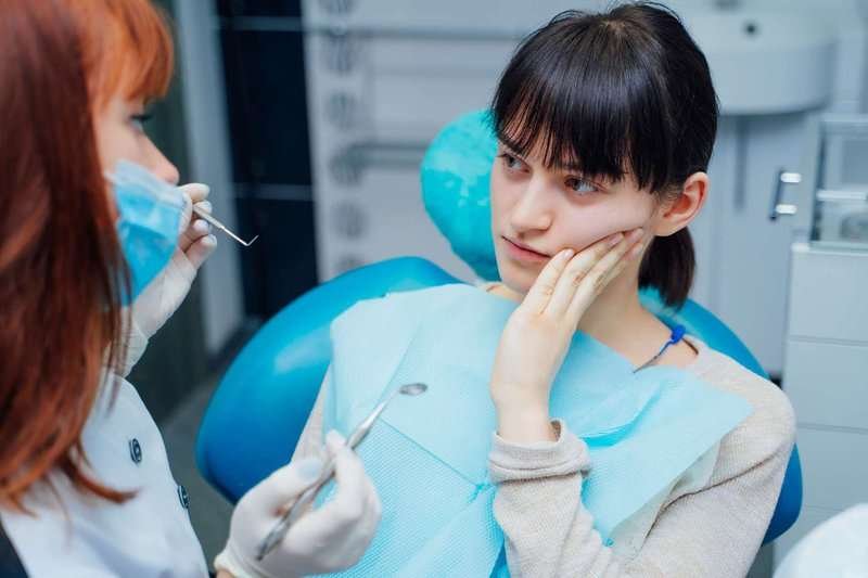 young woman at the dentist